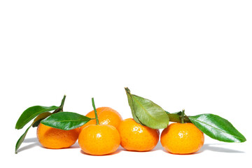 Pile of mandarins with leaf isolated on white background