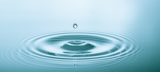 Splash of water droplets on a smooth water surface