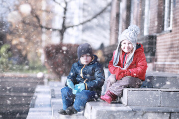 Kids walk in the park first snow
