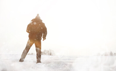 A man on a walk. Winter landscape. Tourist in winter journey.