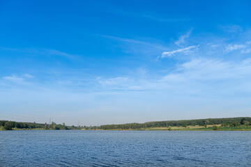 Landscape view of reservoir with green forest under blue sky. At Ang Kep Nam Dok Krai Rayong Thailand.