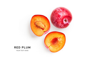 Red plum fruits creative layout.