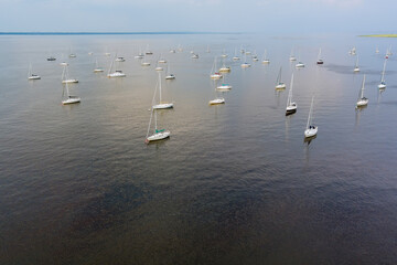 Aerial top view of sailboat harbor many beautiful yachts in the sea port water transport summertime vacation