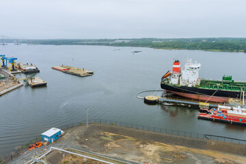 Fototapeta premium Aerial view tanker ship, oil ship operation during petroleum transfer