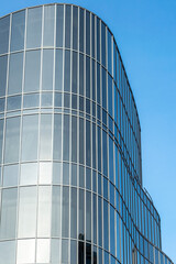 Fototapeta na wymiar Building with a modern and curved glass facade, Nuremberg, Bavaria, Germany