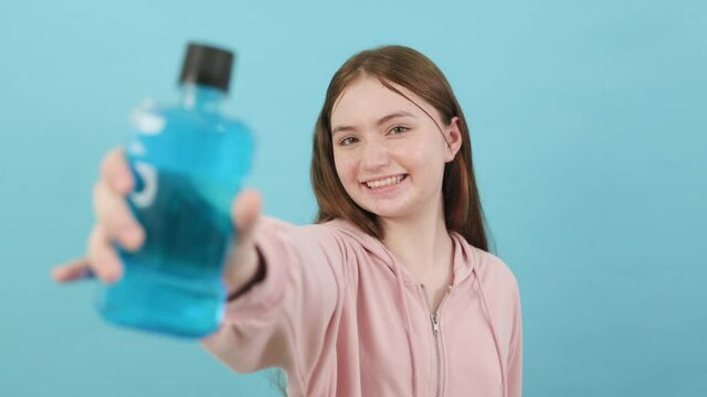Dental Beautiful smiling of young  woman with retainer braces glad emotion with white teeth increase confidence for healthy on blue background isolated, Happy funny teen girl brush .