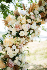 wedding ceremony area with dried flowers in a meadow in a forest