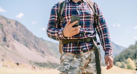 one person using mobile phone in the mountains