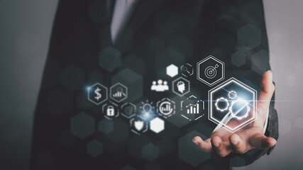 Business process objectives,innovation Operations Management, Process and problem Solving,Workflow, analysis concept. Businessman hold plans on a virtual screen using a digital pen.