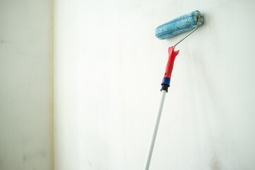 Wall is ready to be painted with a sponge roller. Home renovation. Copy space.