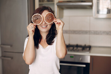 Woman holding dried fruits in her hands.