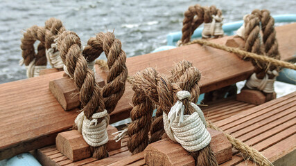 Stormtrap made of Manila rope, fixed on board the ship near the rail. The balusters are made of...
