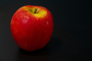 red apple with a black and white background