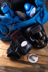 Boxing equipment and duffel bag. Boxing gloves and safety helmet.