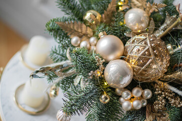 Beautiful winter Christmas floral composition of fresh Nobilis in hat box. Cotton, spruce, sparkling ornaments. Holiday concept. Happy New Year decorations.