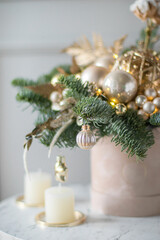 Beautiful winter Christmas floral composition of fresh Nobilis in hat box. Cotton, spruce, sparkling ornaments. Holiday concept. Happy New Year decorations.