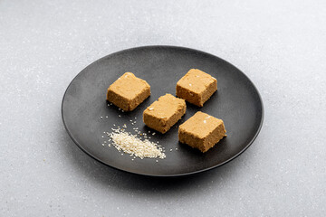 

Til mawa cake or Gajak  is a dry sweet cake - made of sesame seeds, ground nuts and jaggery, consumed in India  especially in winter during Makar Sankranti and Lohri festival