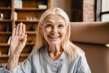 Video call concept. Mature businesswoman teacher freelancer CEO having video conference meeting...