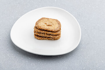 Gajak or til patti is a dry sweet cake - made of sesame seeds, ground nuts and jaggery, consumed in India  especially in winter during Makar Sankranti and Lohri festival