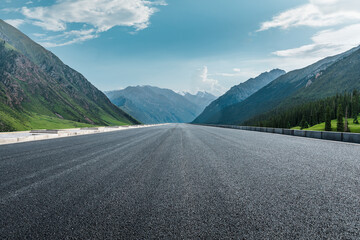 Straight asphalt road and mountain under blue sky. Highway and mountain background. - Powered by Adobe