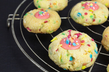 thumbprint cookies filled with chocolate ganache and sugar sprinkles