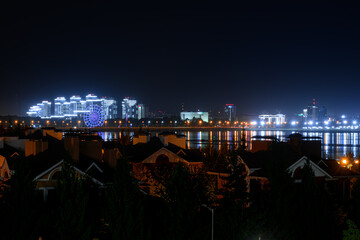 lights of the night city reflected in the water