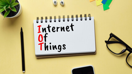 Iot or Internet of things concept. Inscription with a marker in a notebook.