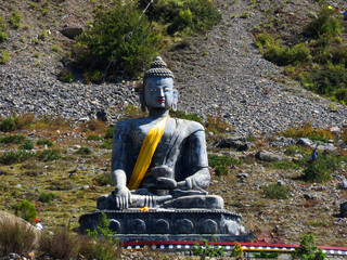 Sakyamuni Buddha Statue, a statue of buddha in Muktinath, Nepal, Buddha stone statue.