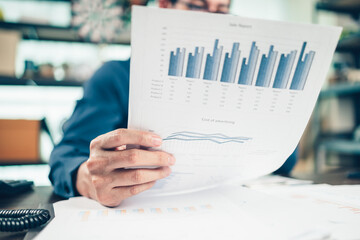 Businessman working on office desk and analyzing new project of accounting finance. Investment, Financial advisor, budget, plan and accounting concept.