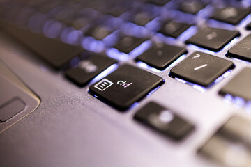Control button  Keyboard ctrl  press type close up macro desktop laptop computer black silver. keyboard with light 