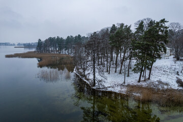 Aerial winter snowy view of Užutrakis manor, Trakai
