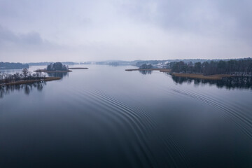 Aerial winter snowy view of lake in Trakai, Lithuania