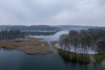 Aerial winter snowy view of lake in Trakai, Lithuania