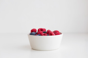 bowl of raspberries and blueberries