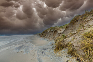Coastal landscape after a heavy storm with severe damage to the dune edge of the Hollands Duin in the Dutch province of South Holland with collapsed dune, 