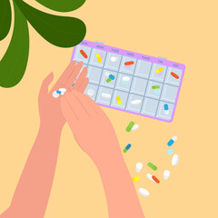 hands holding pills with medication aid