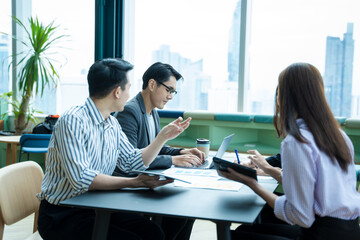 Business partners working together on project at office,Discussion documents and ideas.