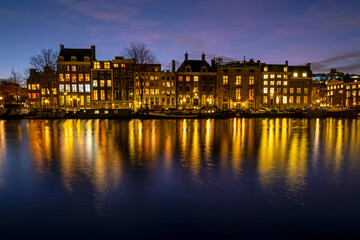 Fototapeta na wymiar City scenic from Amsterdam at the river Amstel in the Netherlands at sunset