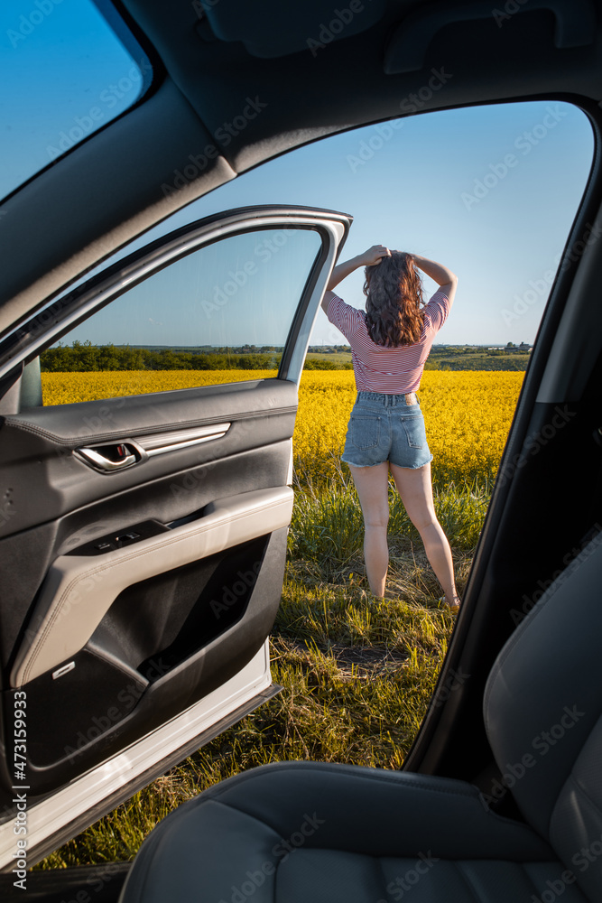 Canvas Prints woman stop to enjoy sunset at road trip