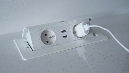 Retractable Pop Up Power Outlet Installed on Kitchen Counter	