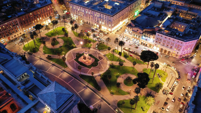 Aerial drone night shot of famous illuminated Piazza Cavour next to supreme court of Rome, Italy
