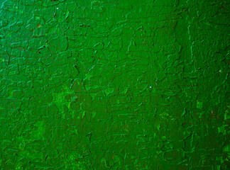 Light green cracked concrete wall texture.