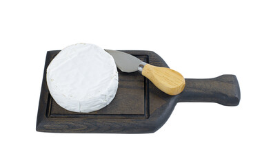 Camembert cheese and a knife on a wooden board, isolated on a white background.