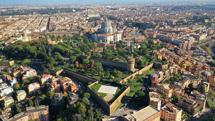 Aerial drone photo of iconic masterpiece Saint Peter Basilica and whole city of Vatican the biggest church in the world, Metropolitan city of Rome, Italy
