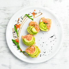 Breakfast. Salmon and avocado sandwiches on white bread. Healthy food. Top view.