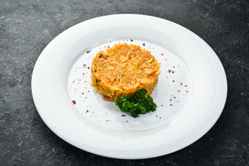 Stewed cabbage with onions on a plate. Top view.