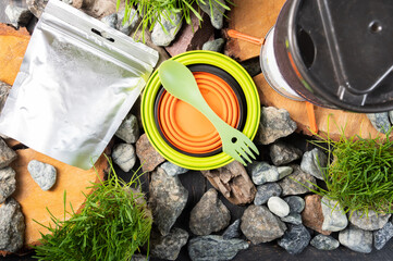 Tourist freeze-dried food. Food in an airtight bag. Fast food. Camping kitchen and utensils.