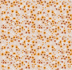 Beautiful floral pattern in small abstract flowers. Small mustard and  earthy colors flowers. Beige background. Ditsy print. Floral seamless background. The elegant the template for fashion prints.