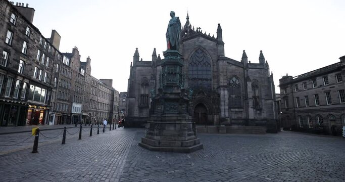 Edinburgh Old Town famous statue of John Knox can be found in front of St Giles Cathedral beautiful and historic parish church in Edinburgh, Scotland. Old town is empty in the morning