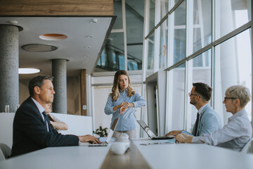 Young business partner explaining project details on a meeting in office